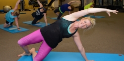 woman doing yoga on a mat